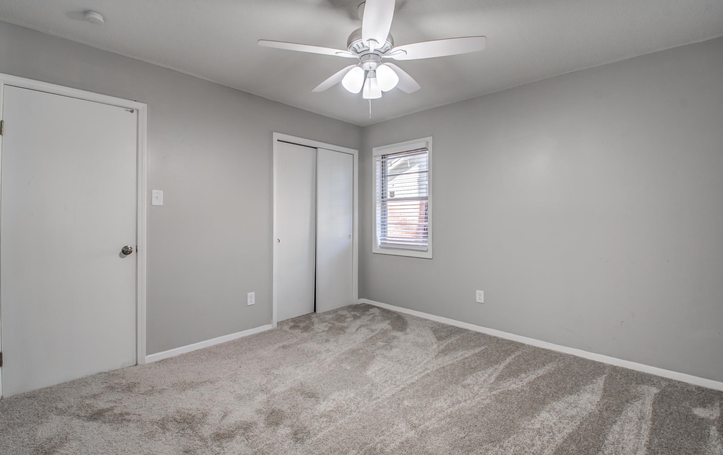 4174 Hobson Road Memphis, TN 38128 - Photo 15 of 24 Unfurnished bedroom featuring carpet, a ceiling fan, and a closet
