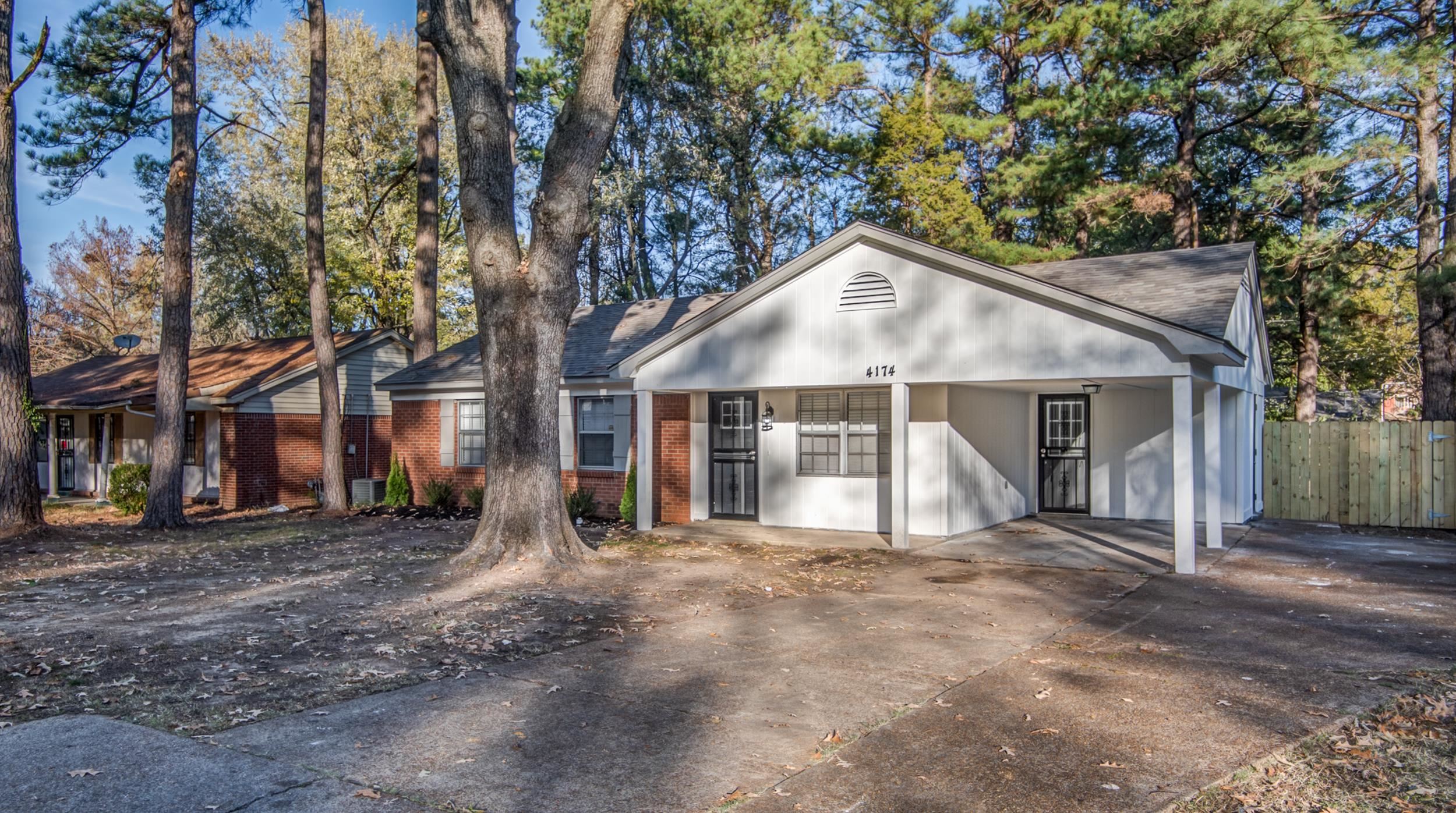 4174 Hobson Road Memphis, TN 38128 - Photo 2 of 24 View of front of property with brick siding, an attached carport, and driveway