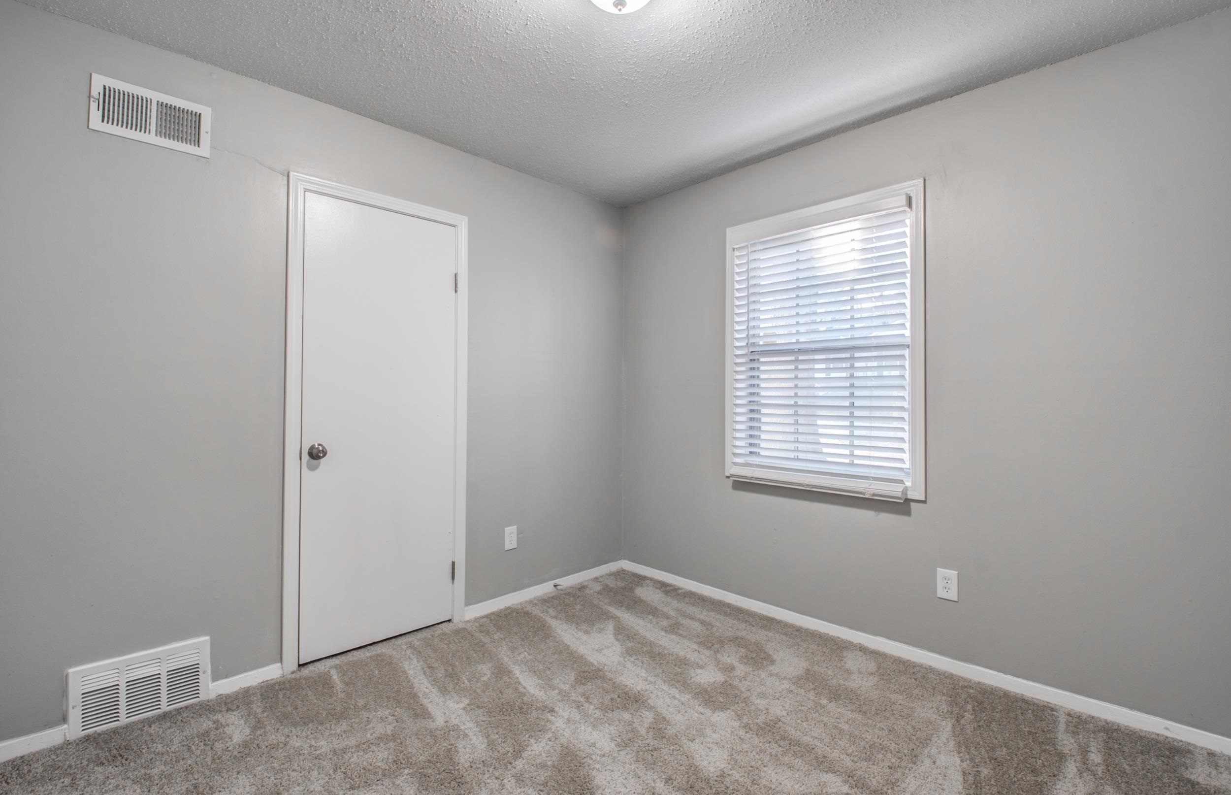 4174 Hobson Road Memphis, TN 38128 - Photo 22 of 24 Empty room featuring a textured ceiling and light colored carpet