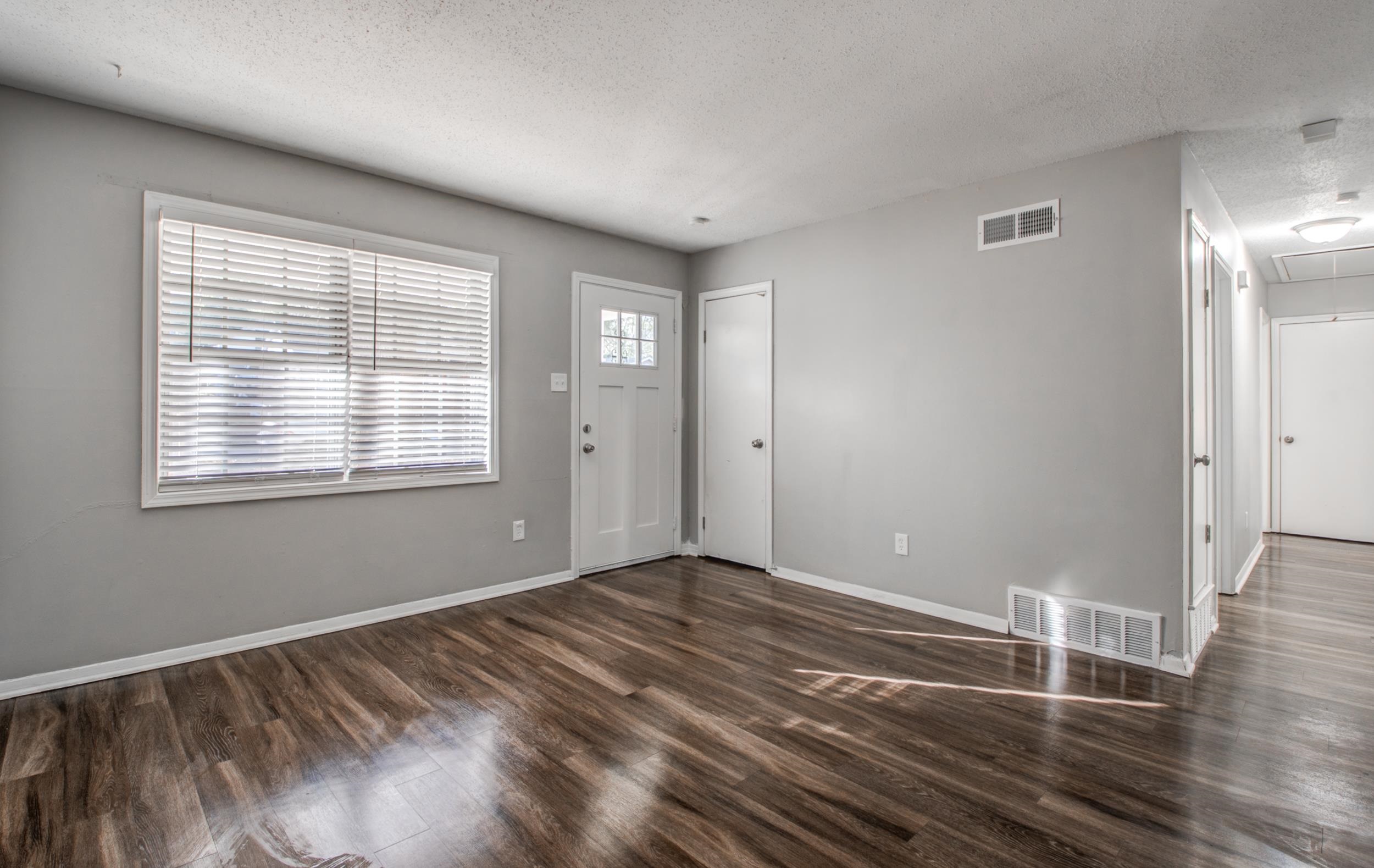 4174 Hobson Road Memphis, TN 38128 - Photo 3 of 24 Foyer entrance with a textured ceiling and dark wood-type flooring