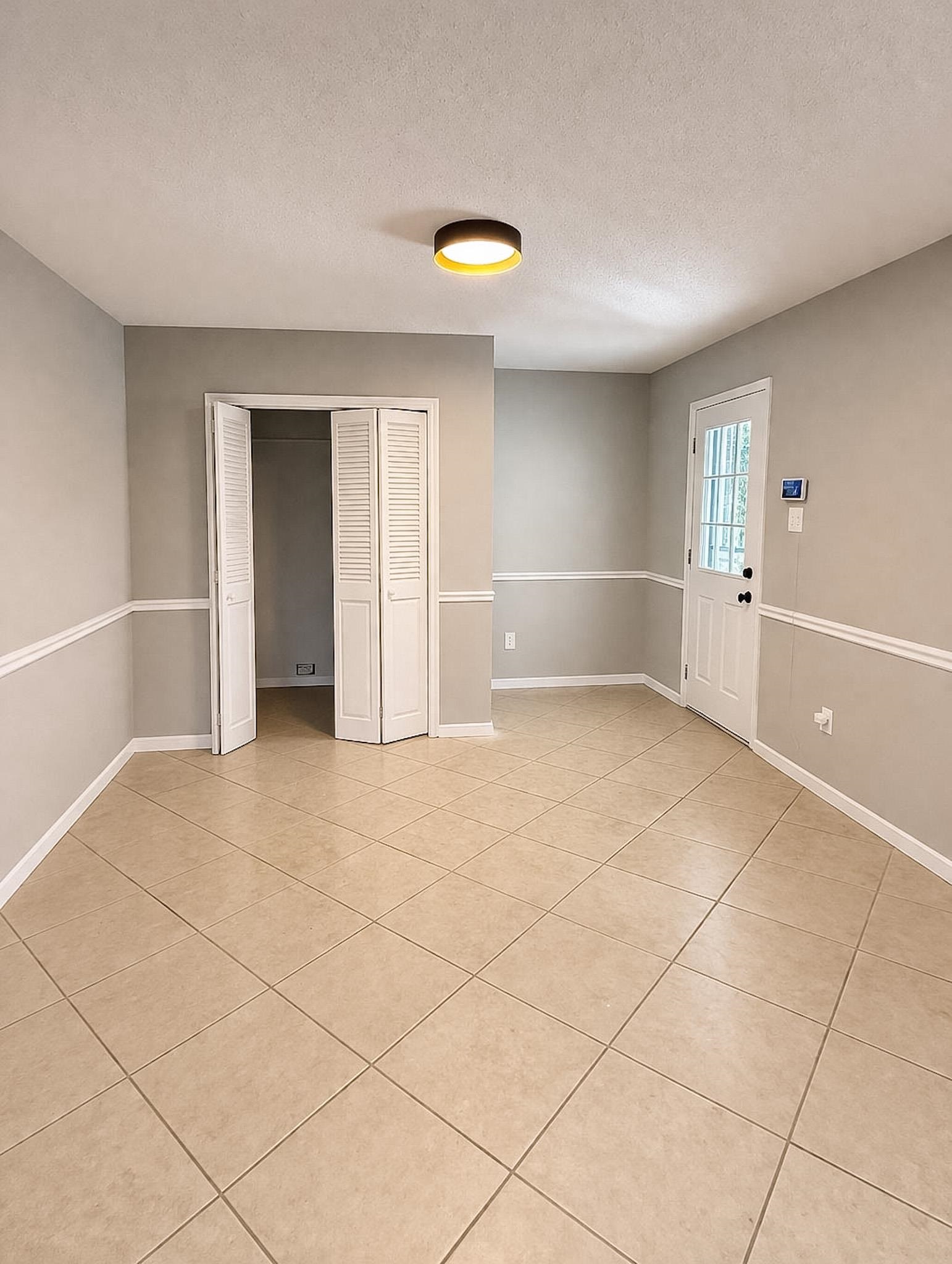 4174 Hobson Road Memphis, TN 38128 - Photo 6 of 24 Unfurnished bedroom featuring a closet, a textured ceiling, and light tile patterned floors