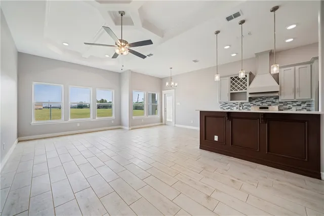 a open kitchen with a sink cabinets and window