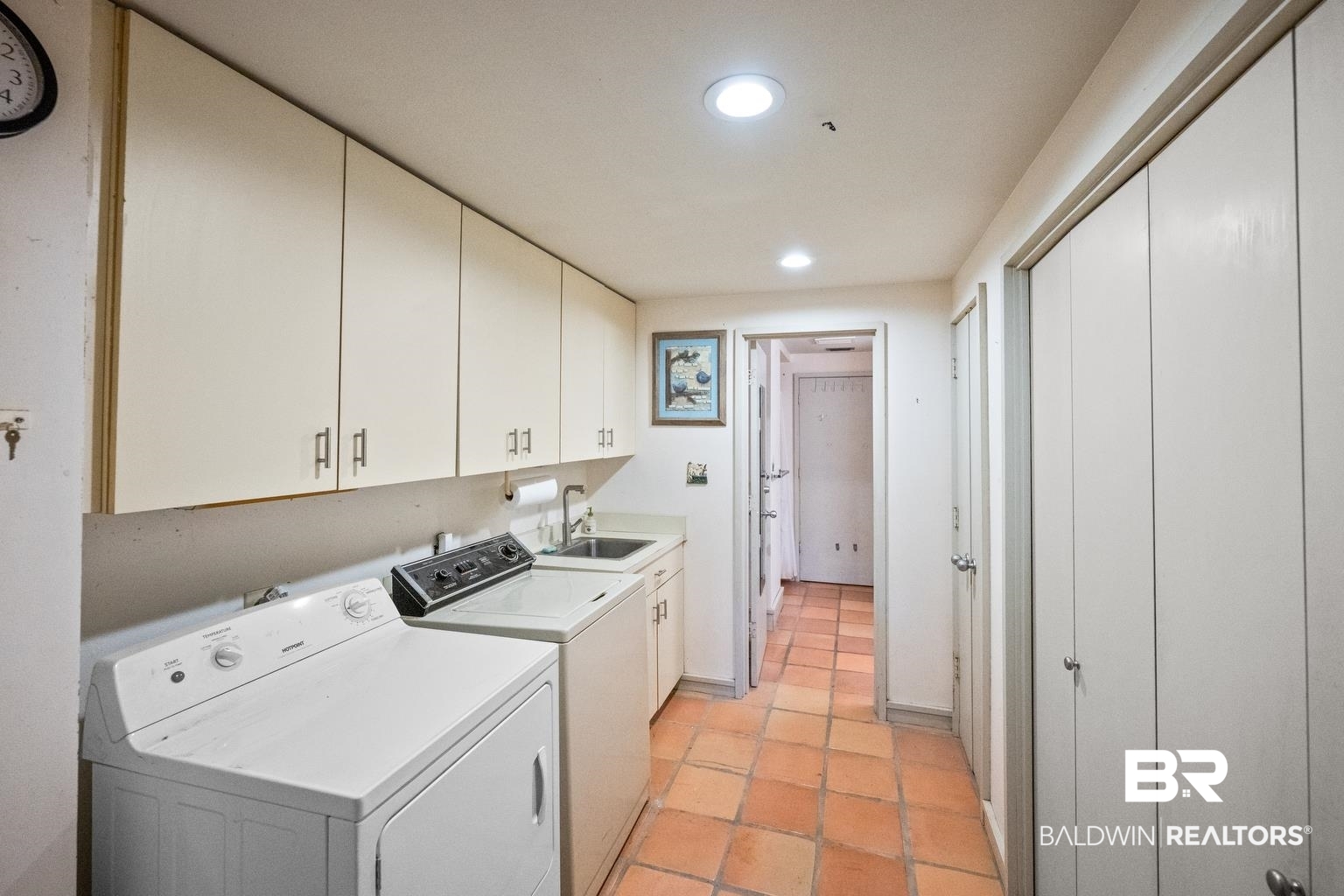 29255 Ono Boulevard Orange Beach, AL 36561 - Photo 40 of 43 Washroom featuring cabinet space, washer and clothes dryer, recessed lighting, and light tile patterned floors