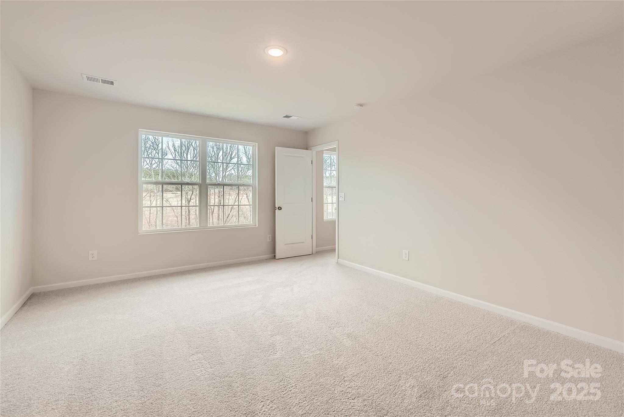 1187 Blackburn Circle Edgemoor, SC 29712 - Photo 8 of 14 an empty room with windows