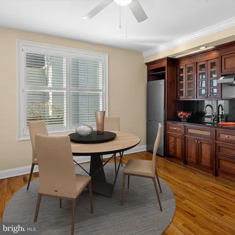 a view of a dining room with furniture and window