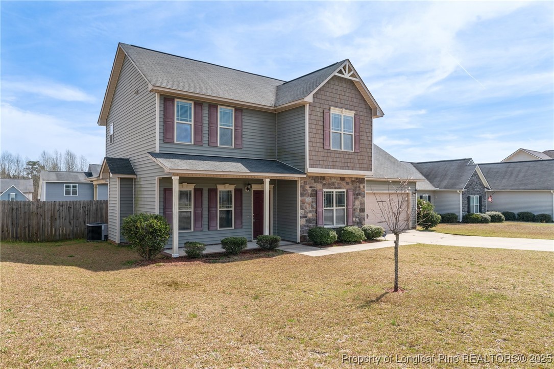 43 Battery Way Bunnlevel, NC 28323 - Photo 2 of 50 a front view of a house with a yard and garage