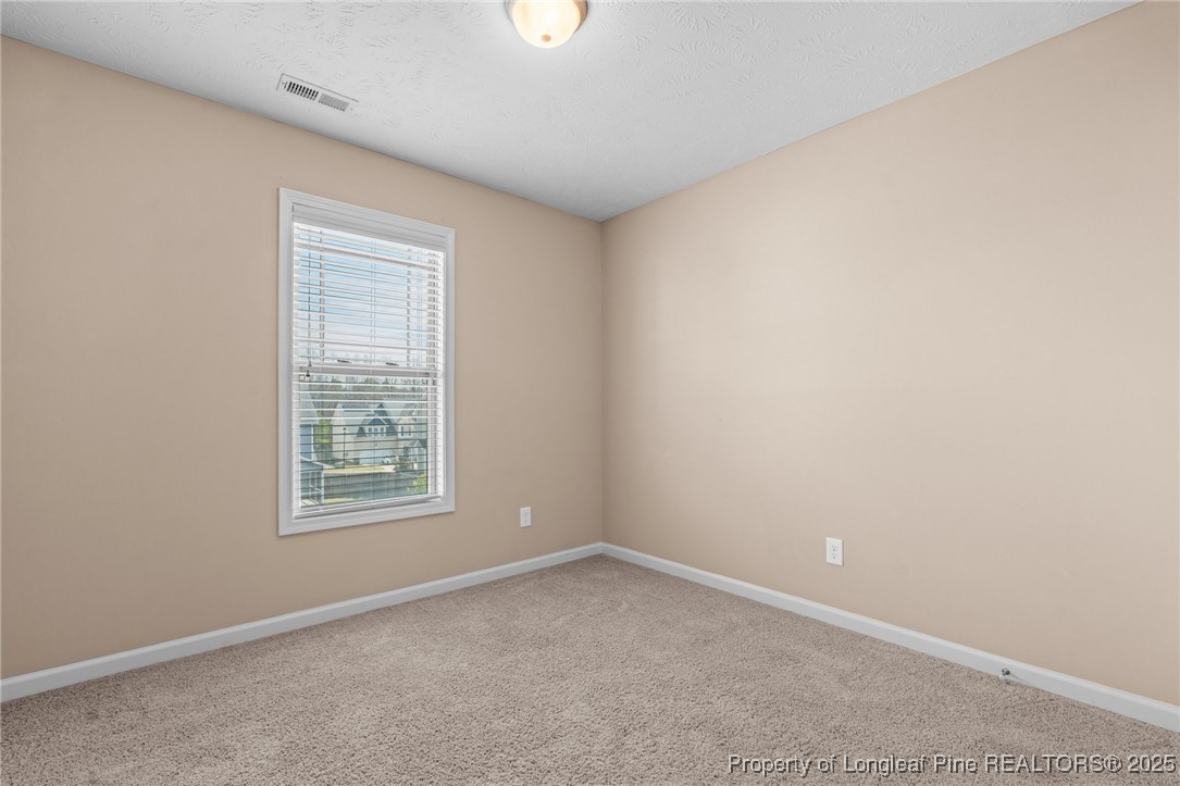 43 Battery Way Bunnlevel, NC 28323 - Photo 32 of 50 an empty room with a window