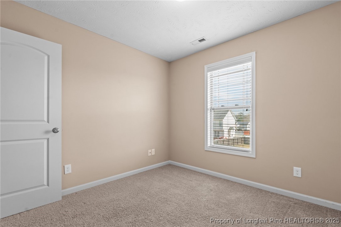 43 Battery Way Bunnlevel, NC 28323 - Photo 33 of 50 an empty room with windows