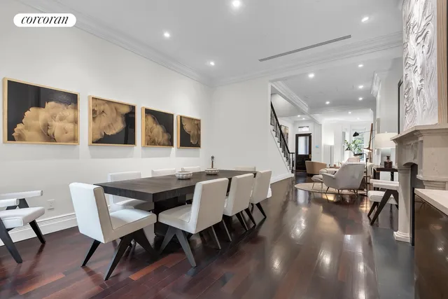 a view of a dining area with furniture and wooden floor