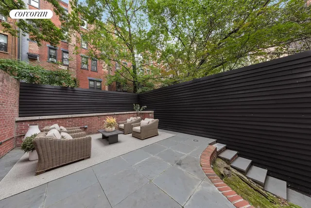a view of backyard with sitting area