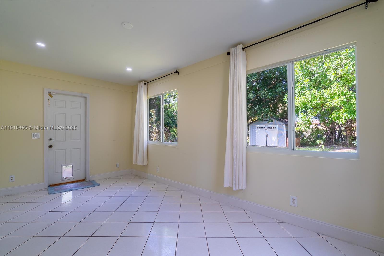 2631 Northwest 47th Avenue Lauderhill, FL 33313 - Photo 8 of 10 an empty room with windows and closet