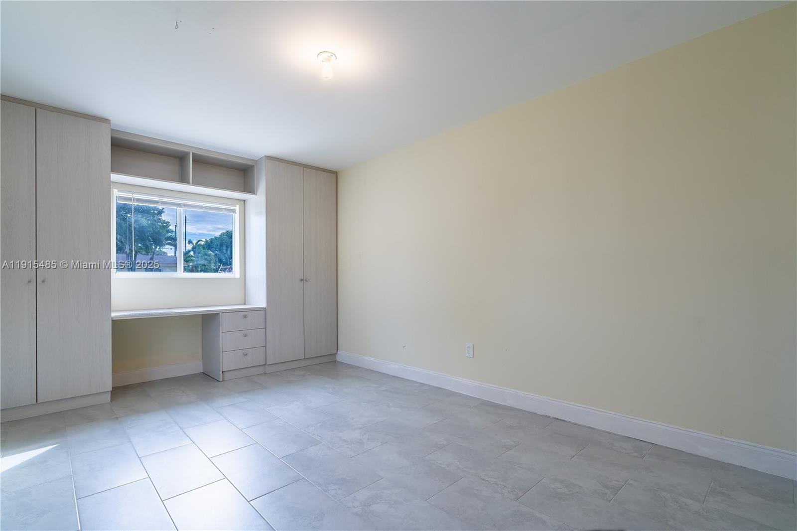 2631 Northwest 47th Avenue Lauderhill, FL 33313 - Photo 9 of 10 an empty room with a window