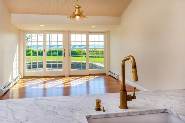 a view of a kitchen with a sink and a window