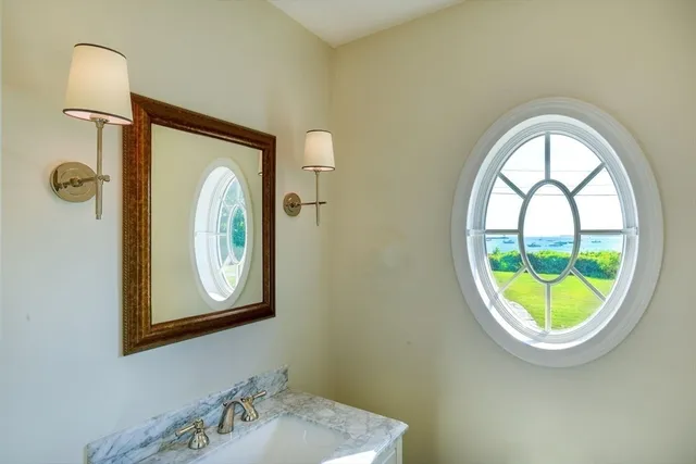 a bathroom with a sink and mirror