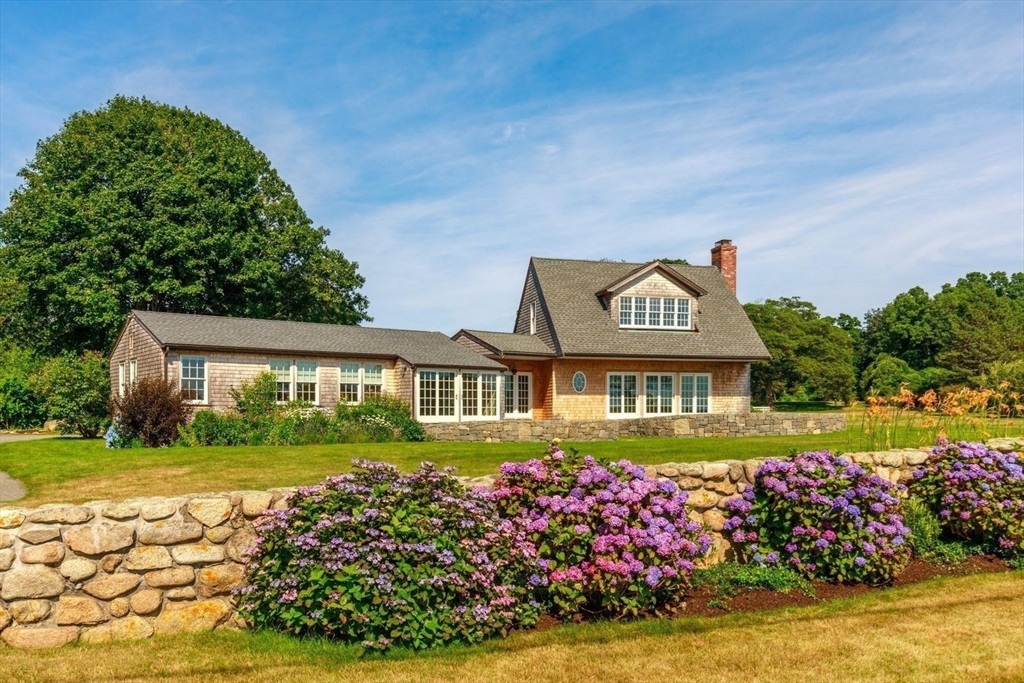100 Eastern Point Boulevard Gloucester, MA 01930 - Photo 9 of 22 a front view of a house with garden