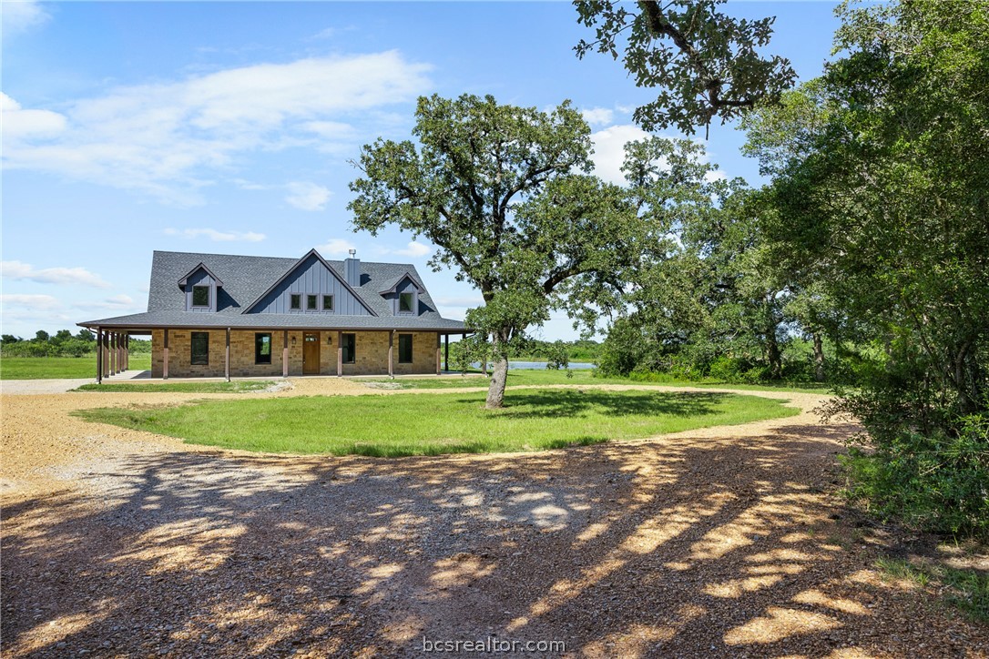 6951 Watermelon Road Somerville, TX 77879 - Photo 1 of 48 Experience the best of Brazos Valley country living at this custom-built home situated on approximately 11 acres in the highly sought-after Snook area.