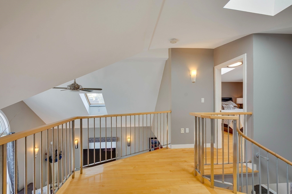 20 Roosevelt Road Medford, MA 02155 - Photo 29 of 39 a view of a hallway with a living space with furniture