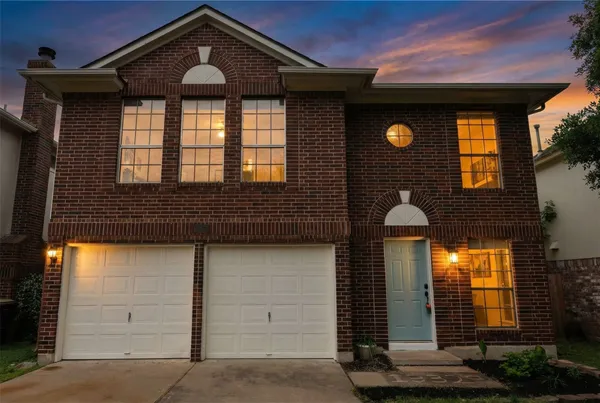 a front view of a house with a garage
