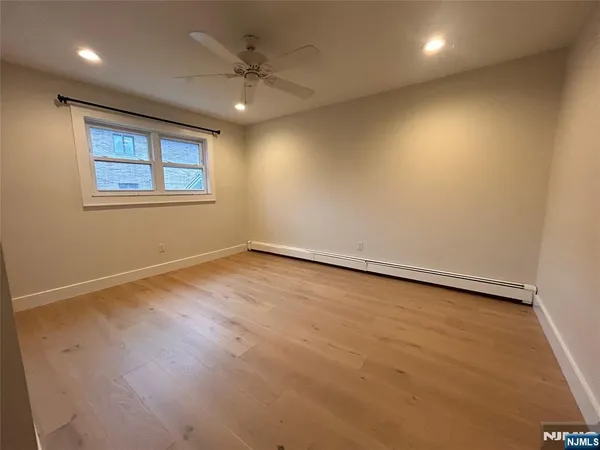 an empty room with a empty space and window