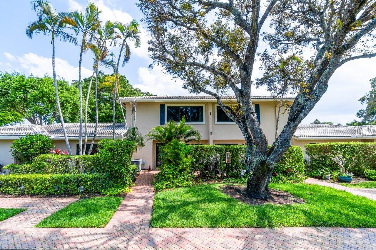 2 Stratford Drive, Unit B Boynton Beach, FL 33436 - Photo 1 of 54 a front view of a house with garden