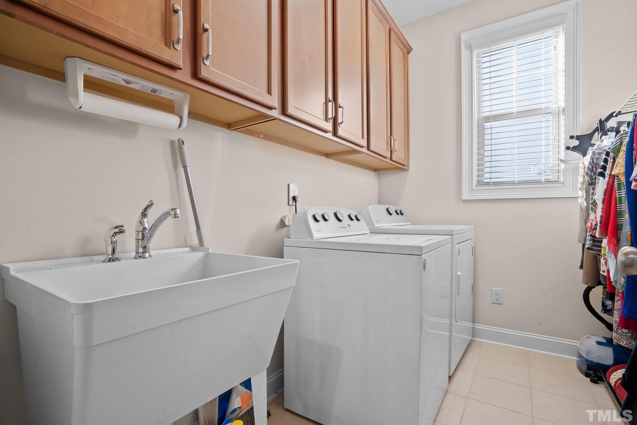 821 Traditions Ridge Drive Wake Forest, NC 27587 - Photo 11 of 14 a utility room with dryer and washer