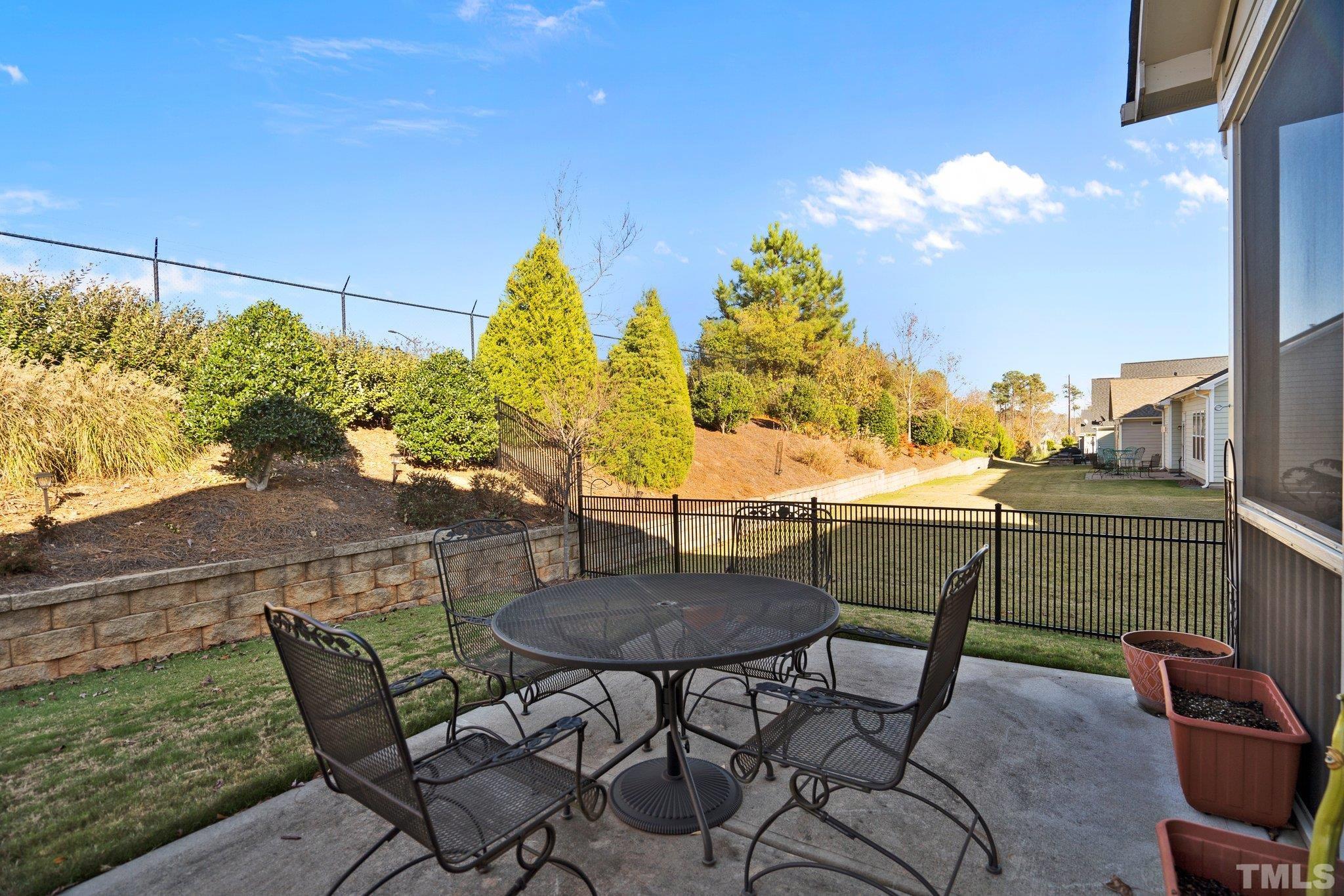 821 Traditions Ridge Drive Wake Forest, NC 27587 - Photo 14 of 14 a view of a chairs and table in patio