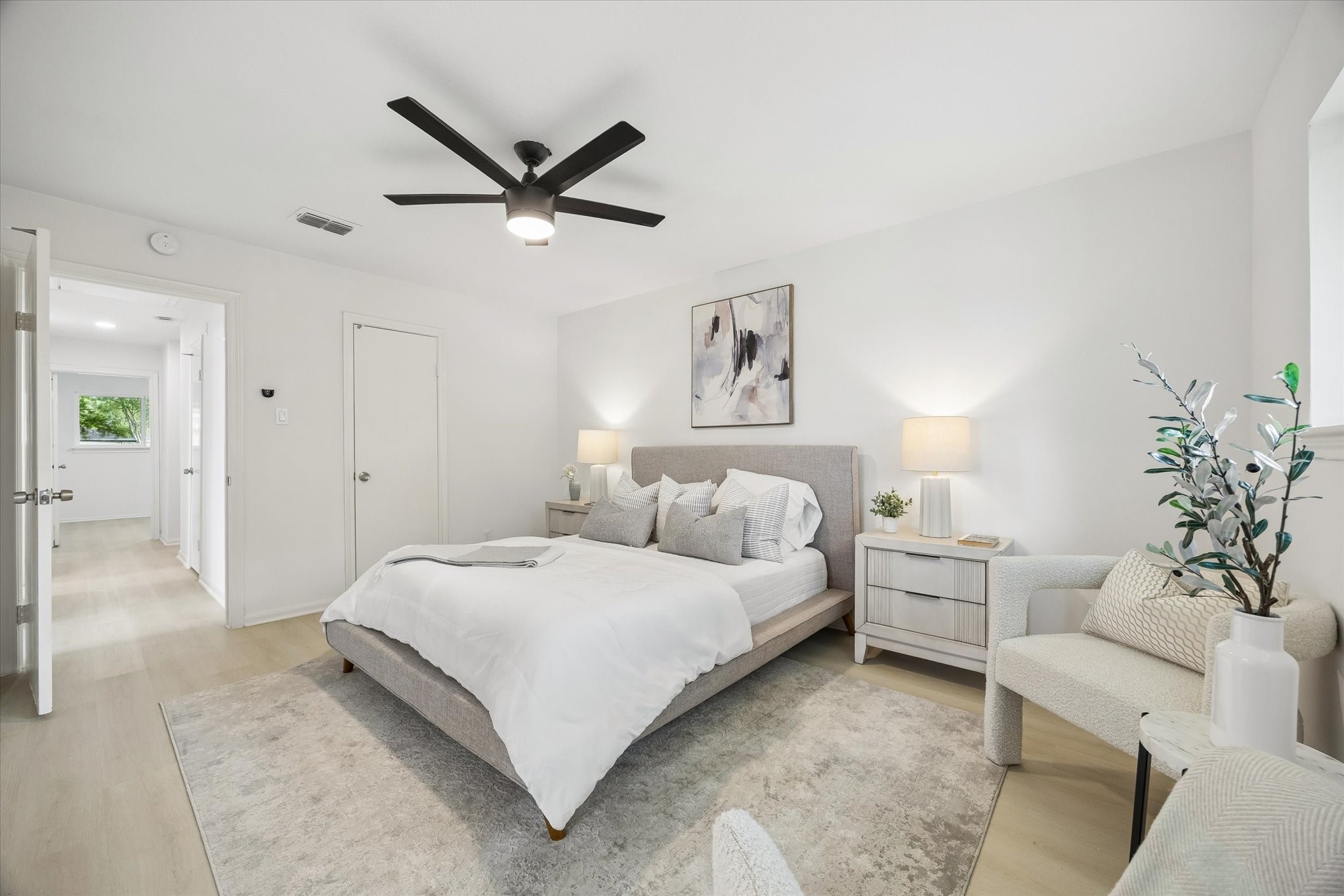 7802 Gulfton Street Houston, TX 77036 - Photo 13 of 20 a bedroom with a bed and a couch