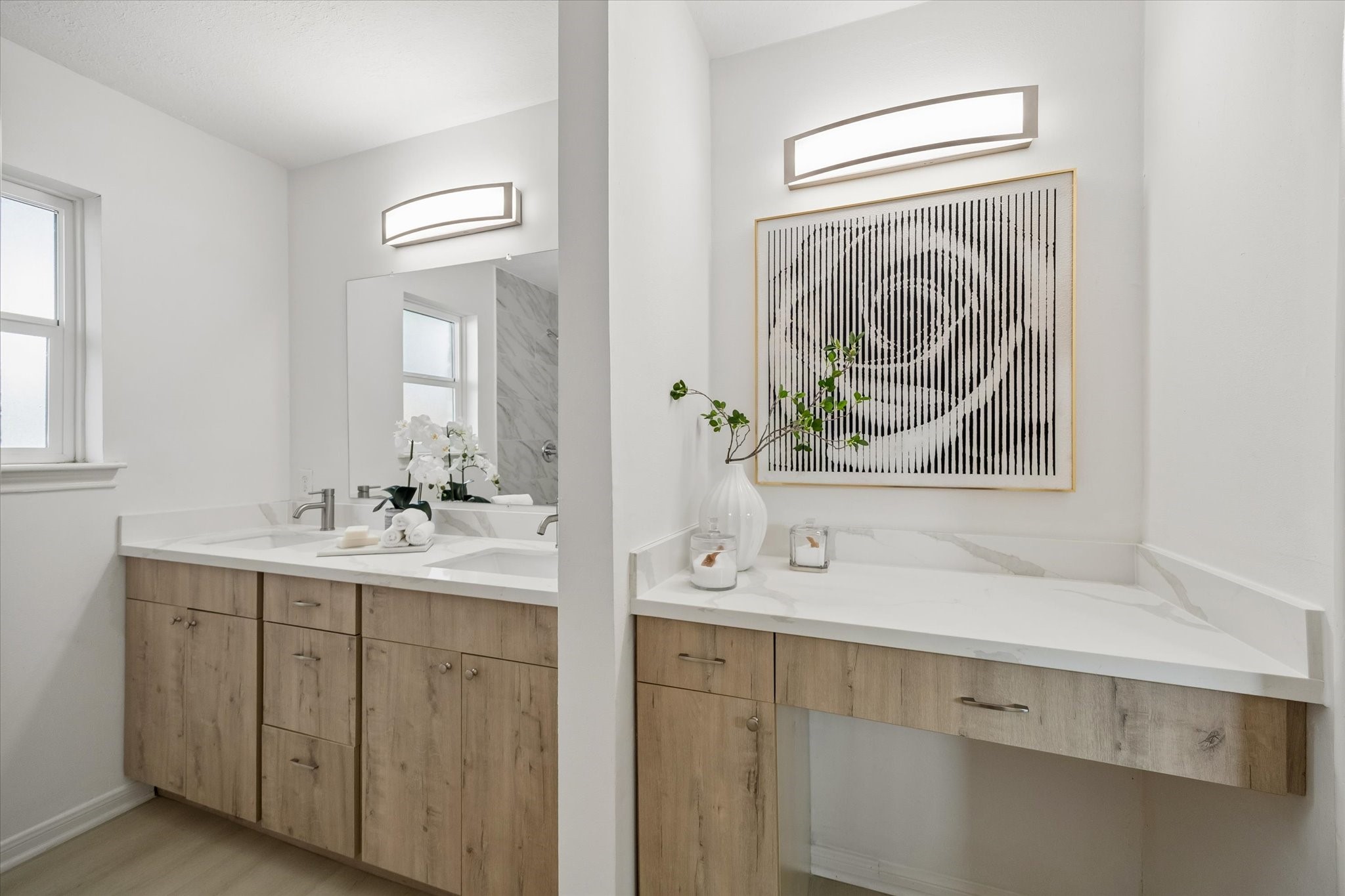 7802 Gulfton Street Houston, TX 77036 - Photo 14 of 20 a bathroom with a sink a mirror and a window