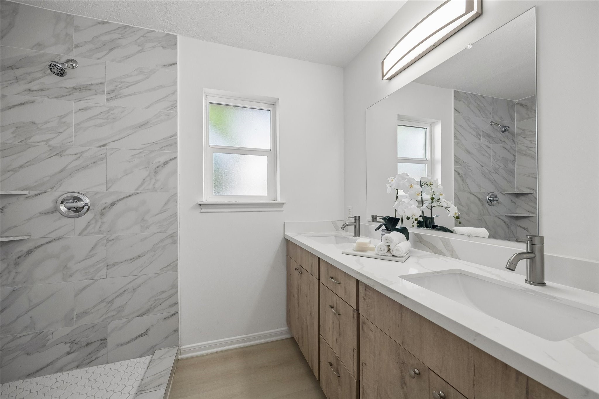 7802 Gulfton Street Houston, TX 77036 - Photo 15 of 20 a bathroom with a sink a vanity and a mirror