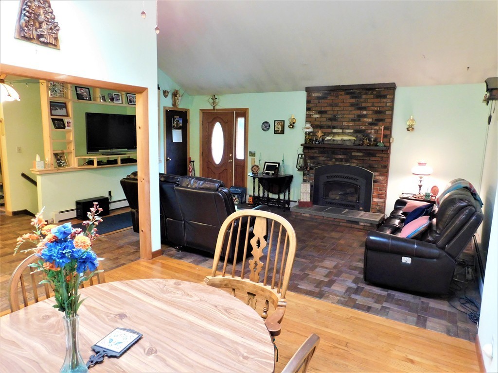 314 Main Road Westhampton, MA 01027 - Photo 12 of 25 a living room with furniture fireplace and flat screen tv