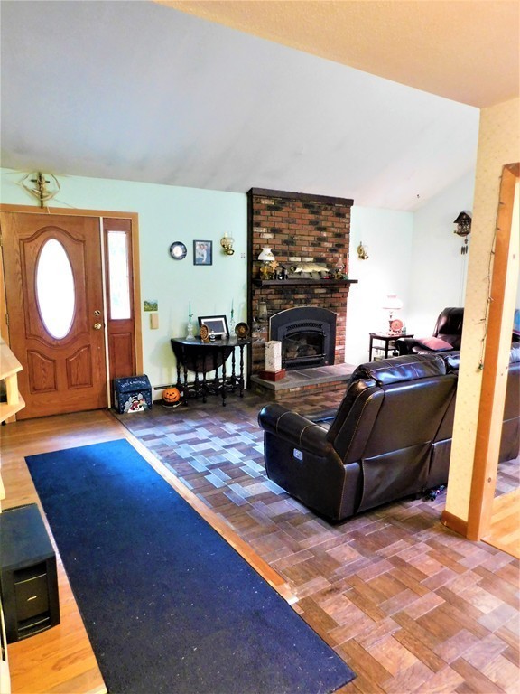 314 Main Road Westhampton, MA 01027 - Photo 16 of 25 a living room with furniture and a fireplace