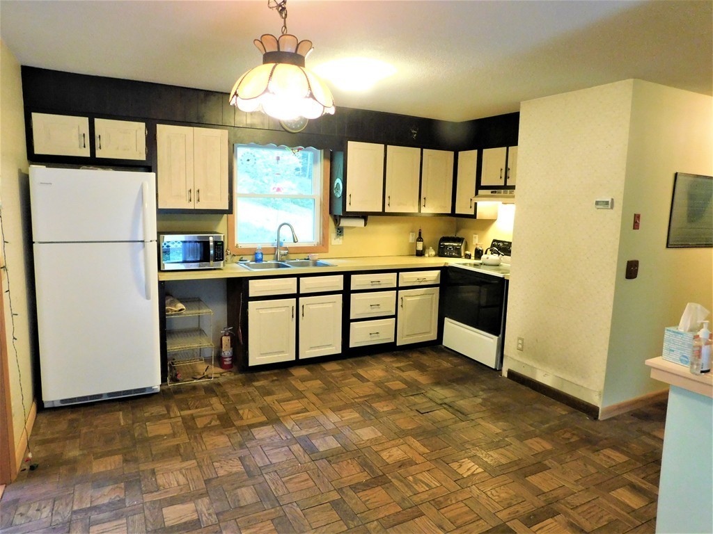 314 Main Road Westhampton, MA 01027 - Photo 17 of 25 a kitchen with stainless steel appliances granite countertop a stove a sink and a refrigerator
