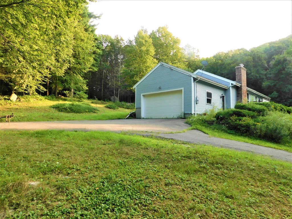 314 Main Road Westhampton, MA 01027 - Photo 2 of 25 a front view of a house with garden
