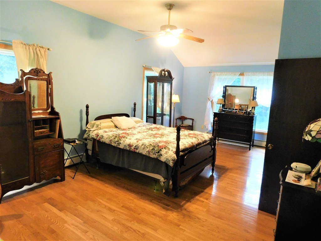 314 Main Road Westhampton, MA 01027 - Photo 6 of 25 a bedroom with a bed and wooden floor