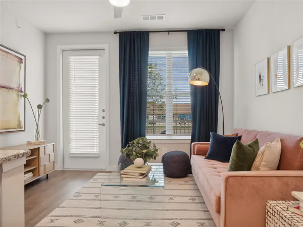 a living room with furniture and a fireplace