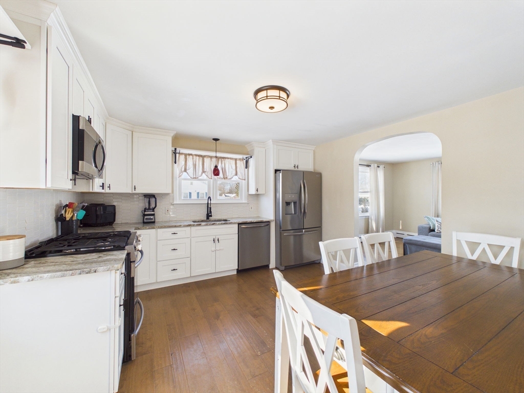 112 Lawson Avenue Acushnet, MA 02743 - Photo 15 of 28 a kitchen with refrigerator cabinets and wooden floor