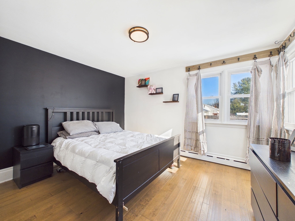 112 Lawson Avenue Acushnet, MA 02743 - Photo 20 of 28 a bed sitting in a bedroom next to a window