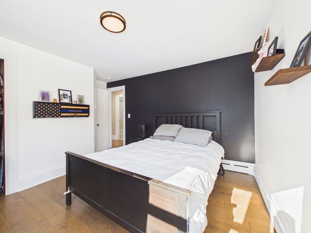 112 Lawson Avenue Acushnet, MA 02743 - Photo 21 of 28 a bedroom with a bed and a painting on the wall