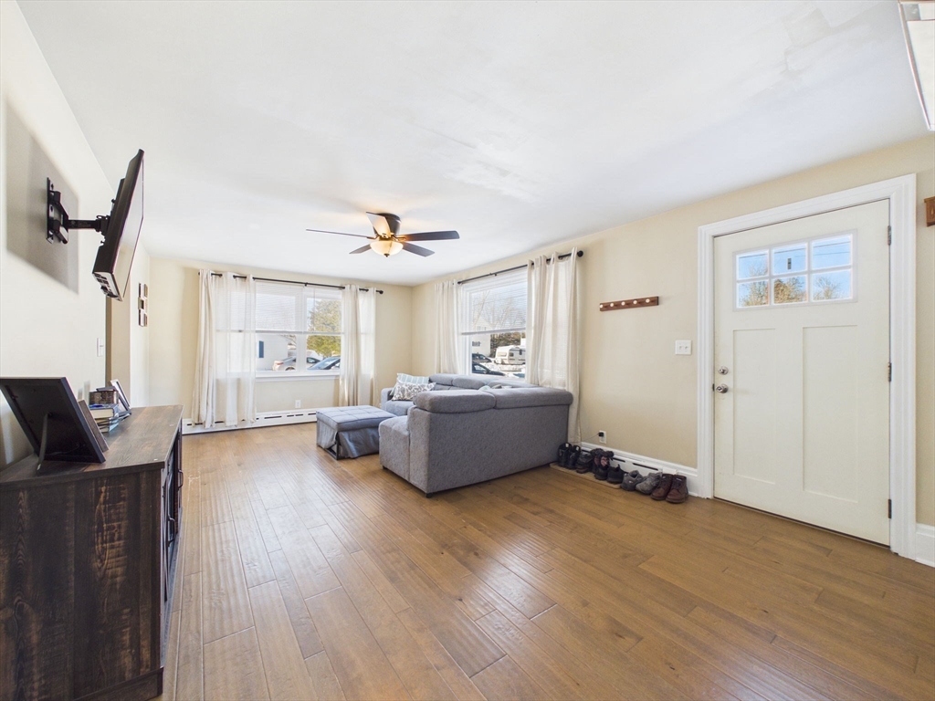 112 Lawson Avenue Acushnet, MA 02743 - Photo 10 of 28 a living room with furniture and a wooden floor