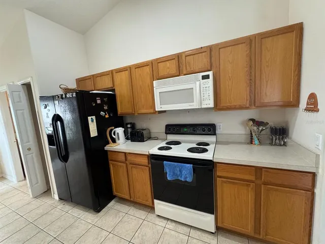 a kitchen with a sink and a stove top oven