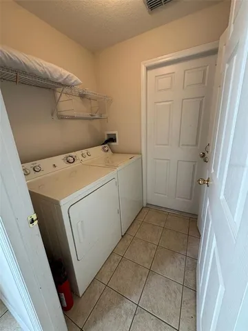 a view of a hallway to rooms