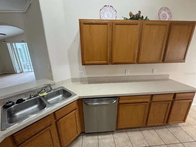 a bathroom with a sink a large mirror and a bathtub