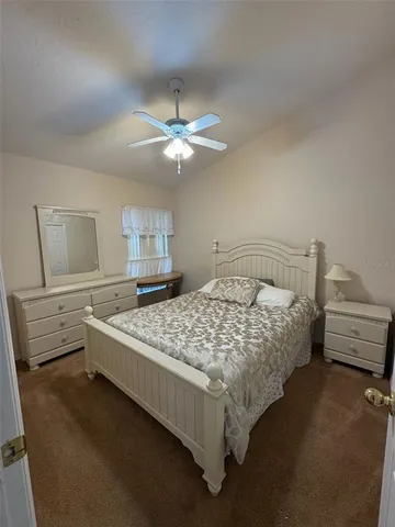 a white toilet sitting next to a sink