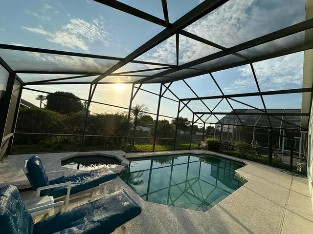 a view of a house with sitting area and garden