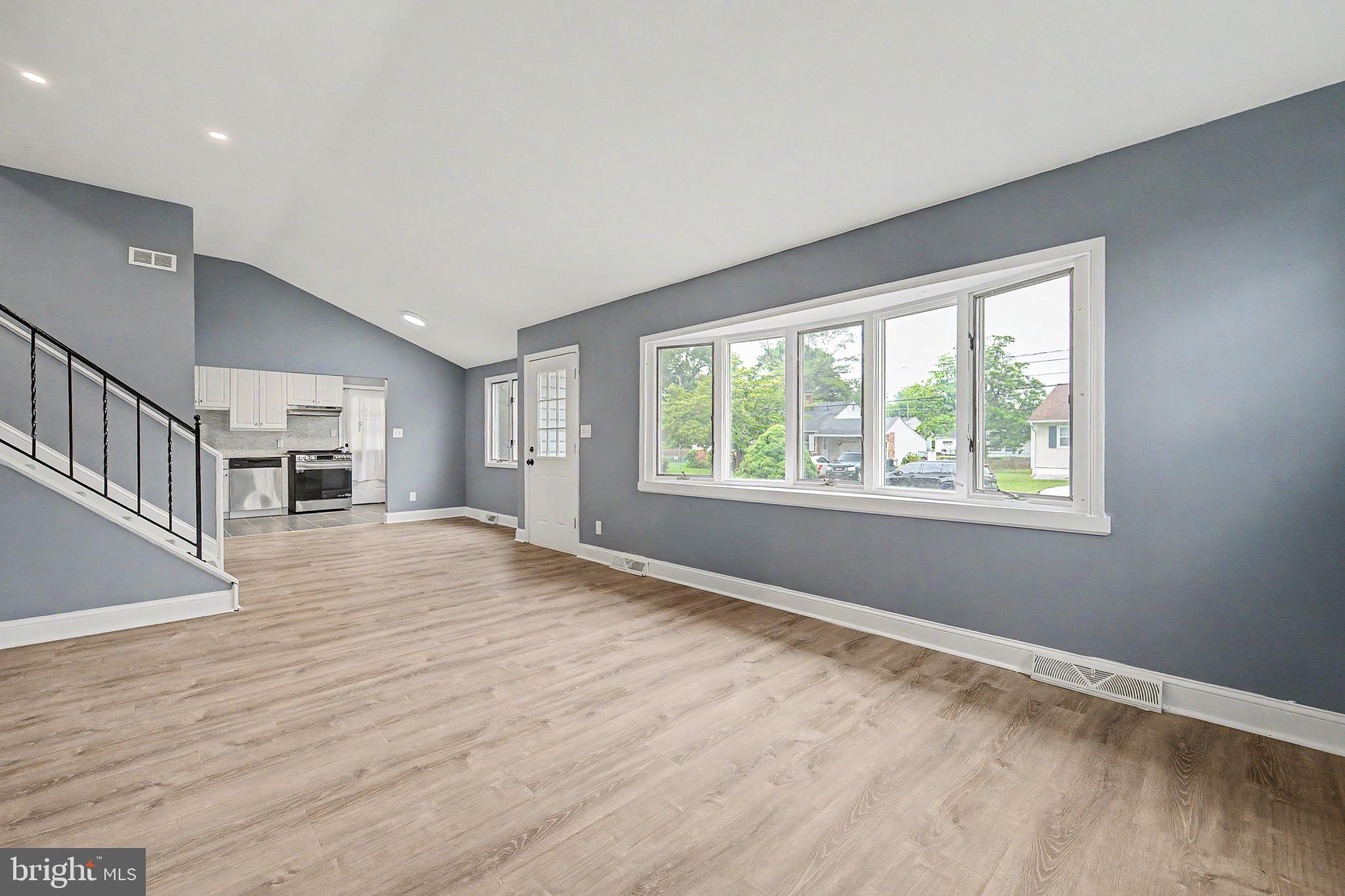 16 Malvern Road Newark, DE 19713 - Photo 7 of 35 a view of an empty room with wooden floor and a window