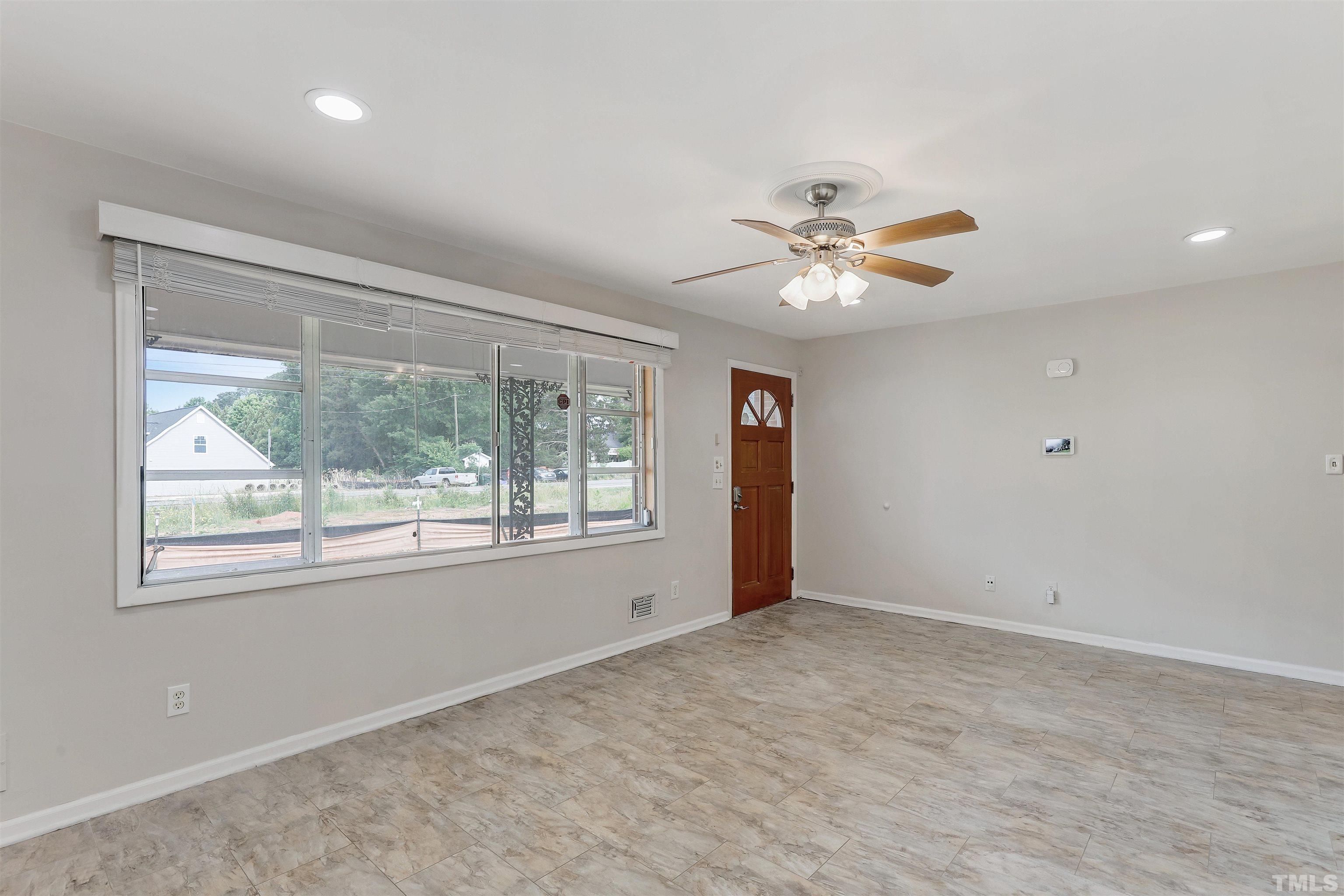 425 Jones Franklin Road Raleigh, NC 27606 - Photo 3 of 27 a view of an empty room with a window