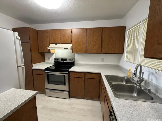 a kitchen with a stove and a microwave