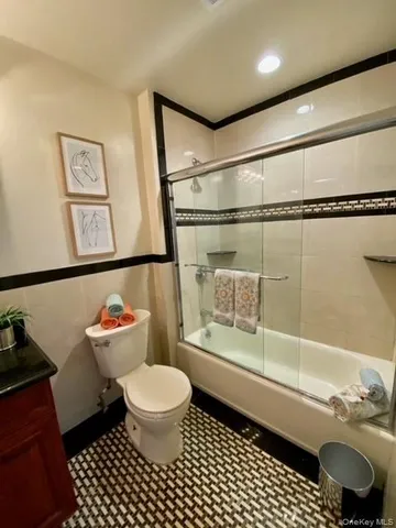 a bathroom with a toilet a sink and a shower