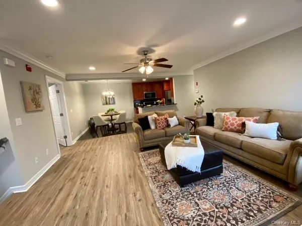 a living room with furniture and a rug