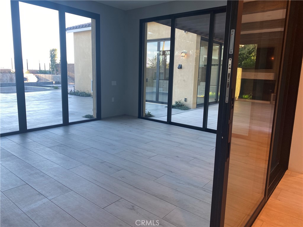107 Iron Gate Irvine, CA 92618 - Photo 13 of 37 a view of an entryway with wooden floor